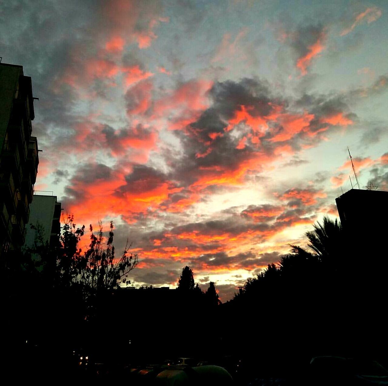 sunset, silhouette, sky, scenics, built structure, architecture, outline, beauty in nature, tranquil scene, cloud, building exterior, cloud - sky, dark, tranquility, orange color, nature, calm, outdoors, dramatic sky, cloudy, no people, high section, majestic, atmospheric mood, multi colored