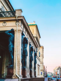 Statue of historic building against sky