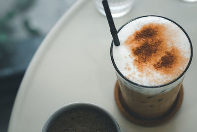 High angle view of coffee cup on table