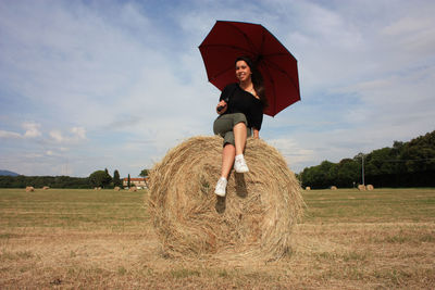 Full length of woman on field against sky