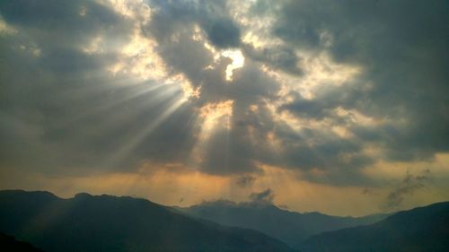 Low angle view of silhouette mountain against sky