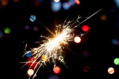 Close-up of sparkler at night