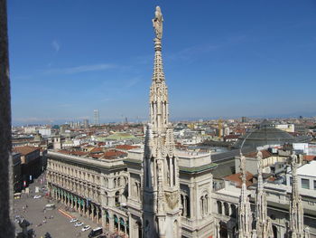 High angle shot of townscape against blue sky