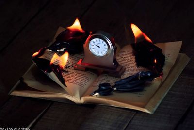 High angle view of illuminated candles on table