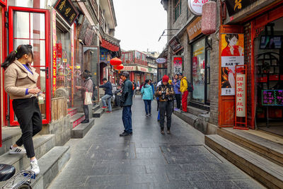 People walking on street in city