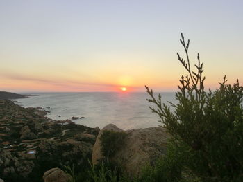 Scenic view of sea against sky during sunset