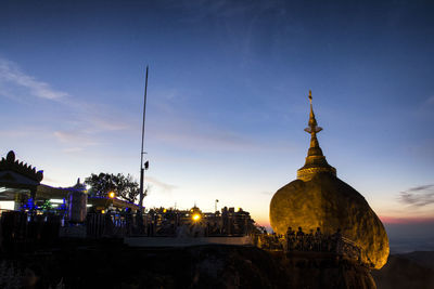 Panoramic view of buildings in city against sky during sunset