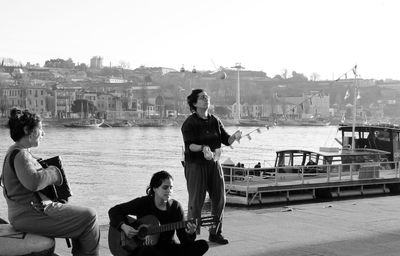 People sitting on boat in river