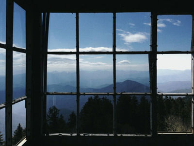 window, indoors, glass - material, transparent, sky, cloud - sky, glass, day, landscape, looking through window, cloud, nature, built structure, mountain, tree, architecture, no people, scenics, tranquil scene, tranquility