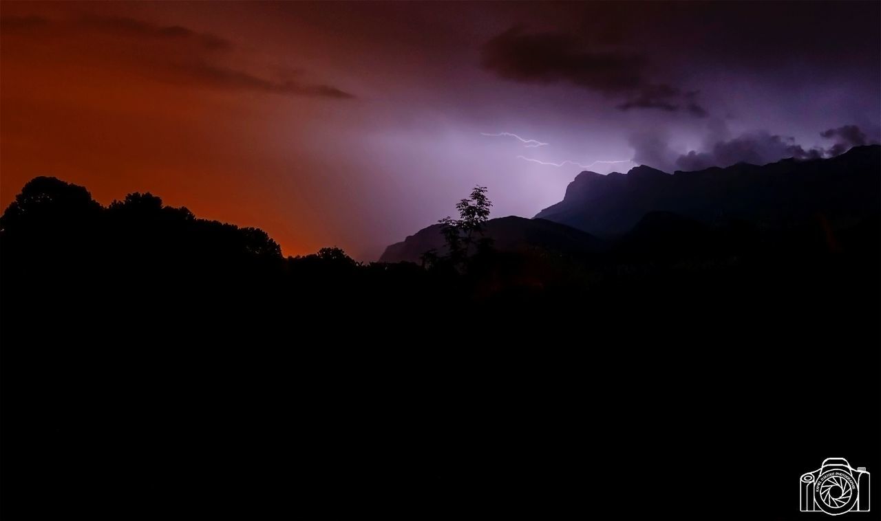 sky, beauty in nature, cloud - sky, silhouette, mountain, scenics - nature, lightning, power in nature, storm, thunderstorm, power, sunset, nature, environment, no people, tranquil scene, idyllic, forked lightning, warning sign