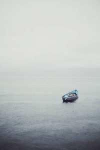 Boat in sea against sky