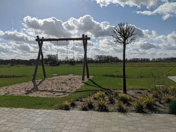 Trees on field against sky