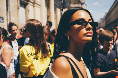 Portrait of smiling young woman in city