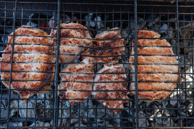 Close-up of meat on barbecue grill