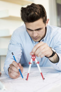 Young man studying in classroom