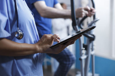 Midsection of man using laptop