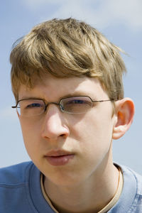 Close-up of teenage boy wearing eyeglasses