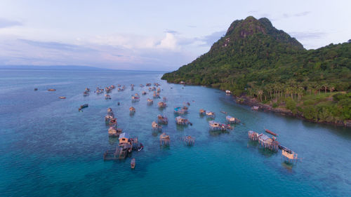 High angle view of boats in sea against sky