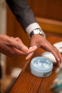 Cropped hands of person preparing food