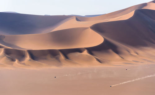 View from nature and landscapes of dasht e lut or sahara desert with car passing by. middle east 