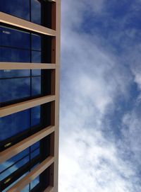 Low angle view of building against cloudy sky