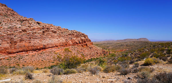 Scenic view of rocky mountains against clear sky