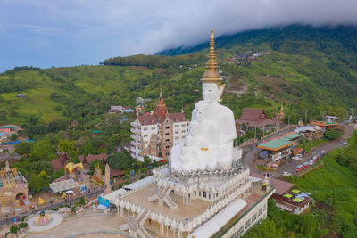 Statue of temple against building