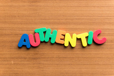 Close-up of text written on wooden table