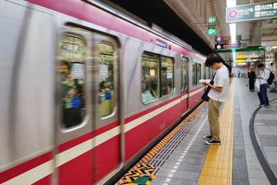 Blurred motion of train at railroad station