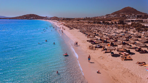 High angle view of people on beach against sky