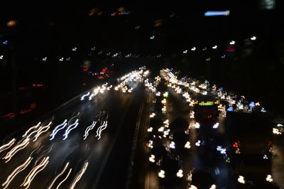 High angle view of light trails on city street at night