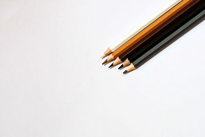 High angle view of pencils against white background