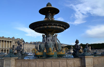 Fountain against blue sky