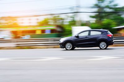 Side view of car on road