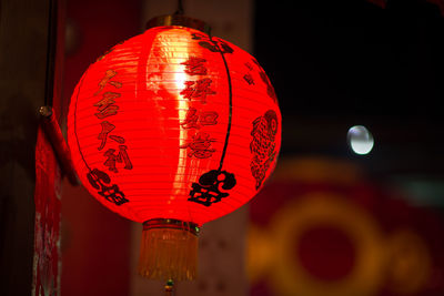 Close-up of illuminated lantern hanging at night