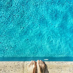 Low section of woman in swimming pool