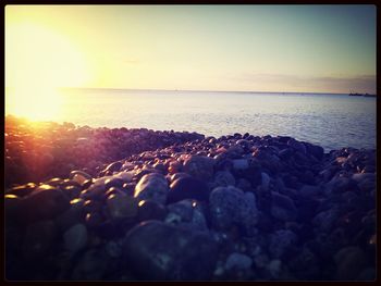 Scenic view of sea at sunset