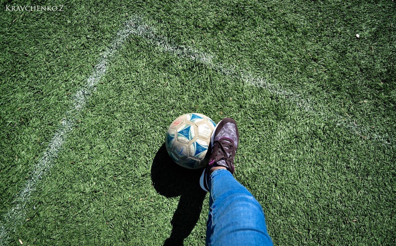 LOW SECTION OF PEOPLE RELAXING ON FIELD