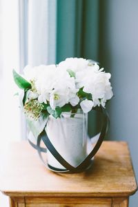 White flowers in vase on table