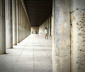 Man in corridor of building