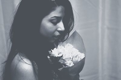 Close-up of woman with flower