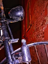 Close-up of electric lamp against wall