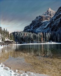 Scenic view of lake against sky during winter