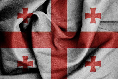 Close-up of red flag on white table