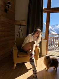 Portrait of young woman with teddy bear