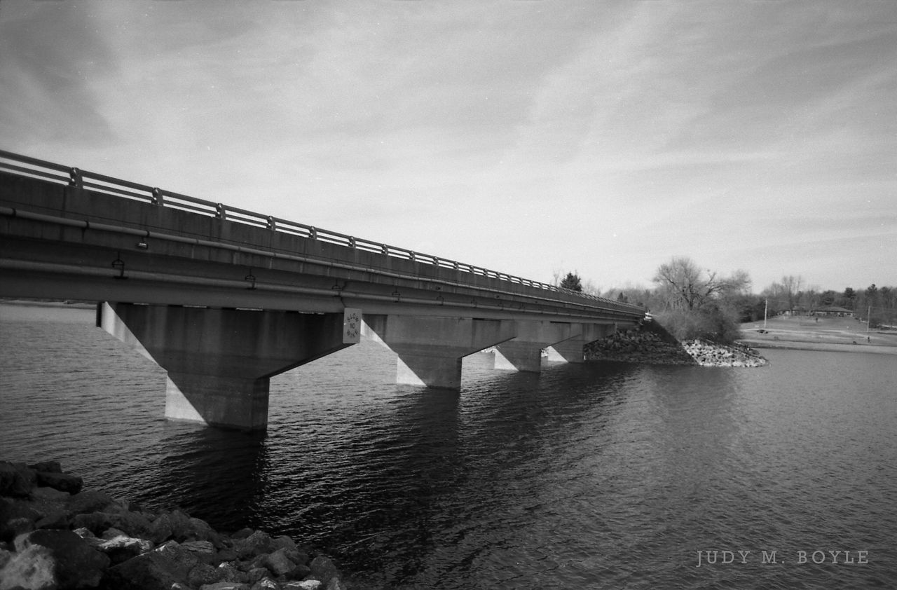 built structure, architecture, water, sky, connection, bridge - man made structure, river, waterfront, cloud - sky, bridge, building exterior, day, nature, outdoors, cloud, reflection, no people, tranquility, sea, engineering