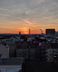 High angle view of buildings against sky during sunset