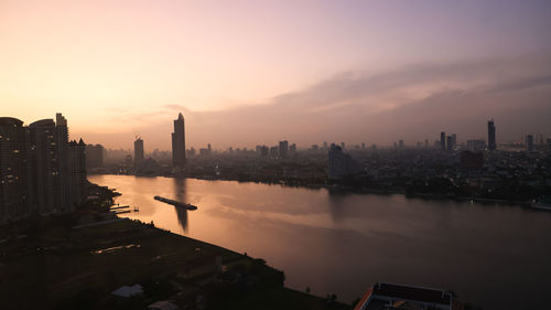 High angle view of city at sunset