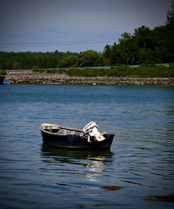 Boat in sea against sky