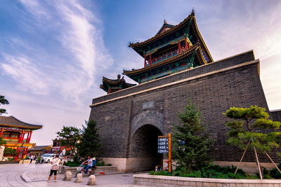 Group of people in temple against building